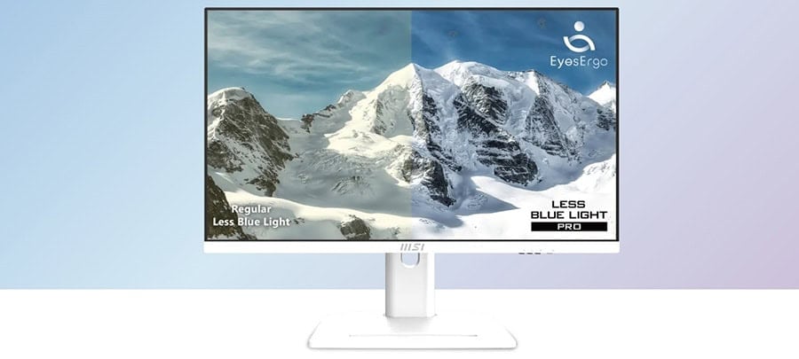 Yüksek dağlar ve karla kaplı zirvelerle doğal manzara, monitör ekranında net ve canlı renklerle gösteriliyor. EyesErgo logosu ve "Less Blue Light" etiketiyle, gözleri koruyan teknolojiyi vurgulayan bi.