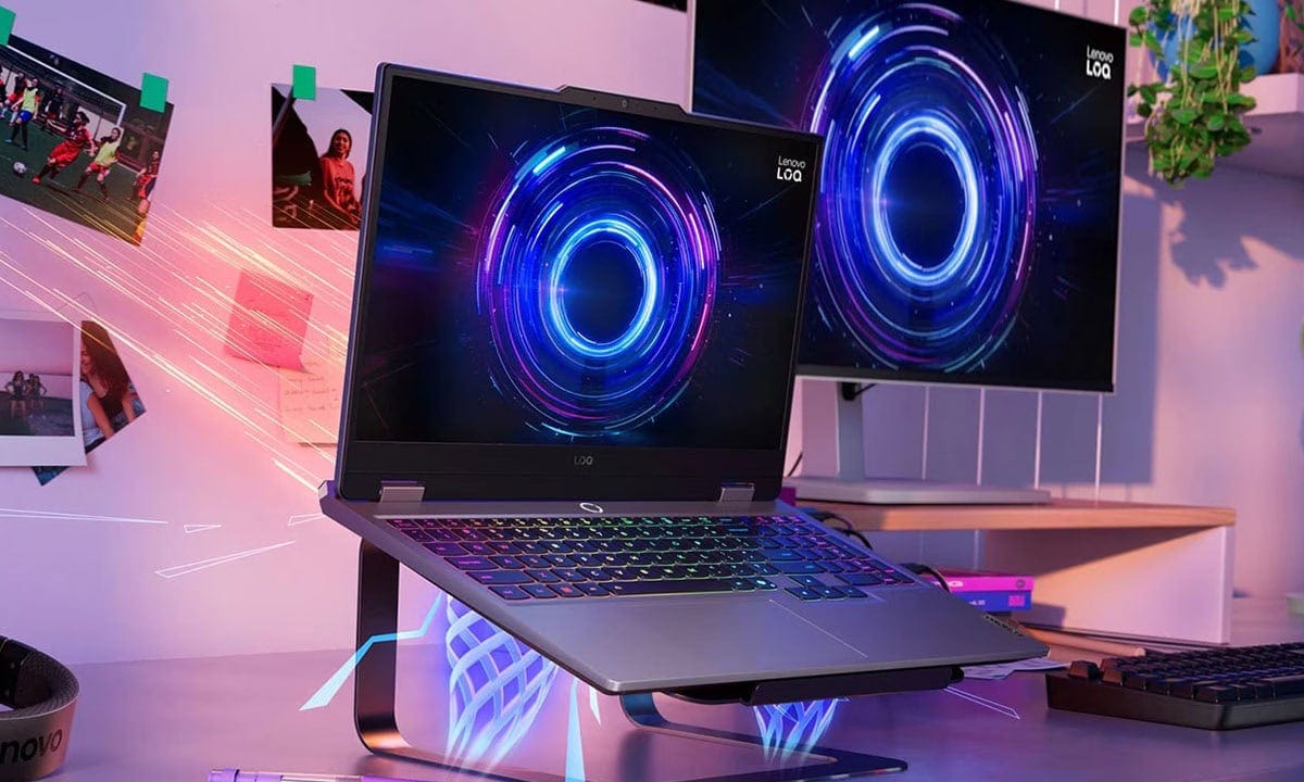 Lenovo LOQ 15IRX10 gaming laptop with dual screens displaying vibrant graphics, set in a modern workspace environment.