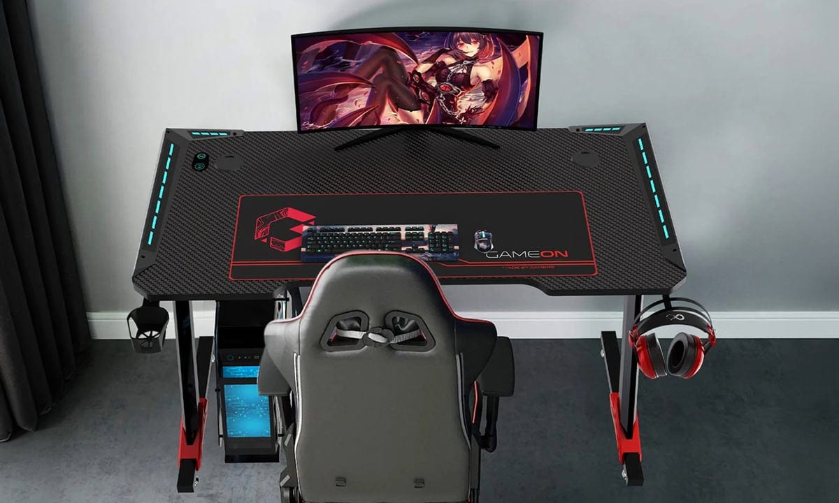 GAMEON Raptor II RGB aydınlatmalı siyah oyuncu masası, geniş çalışma yüzeyi ve ergonomik tasarımıyla oyun ve çalışma alanı için ideal.